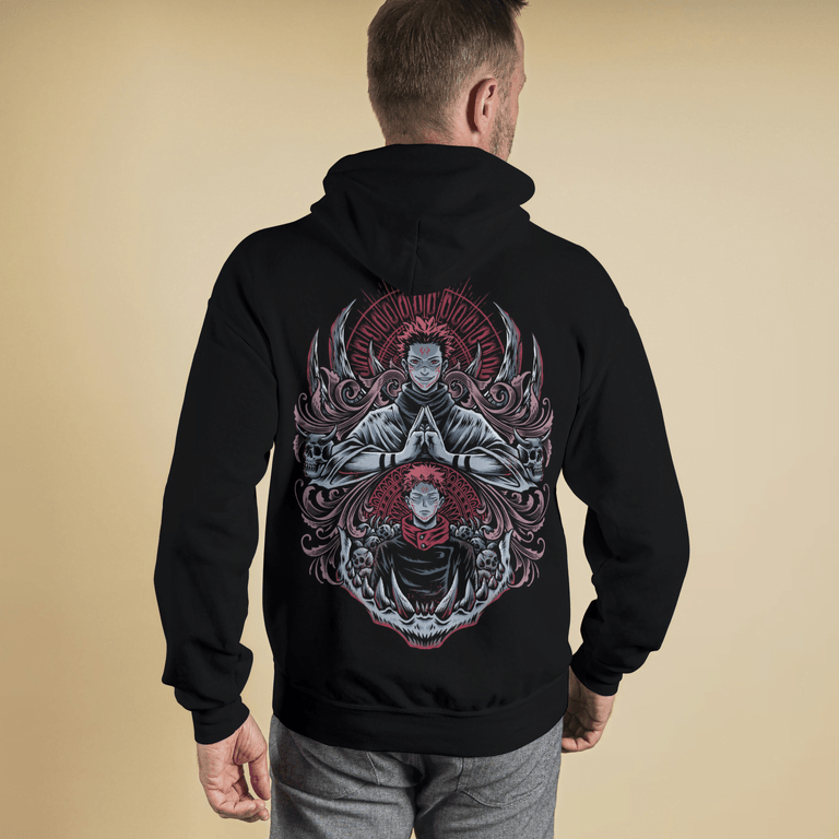 Person wearing a black hoodie with a detailed design on the back against a beige background